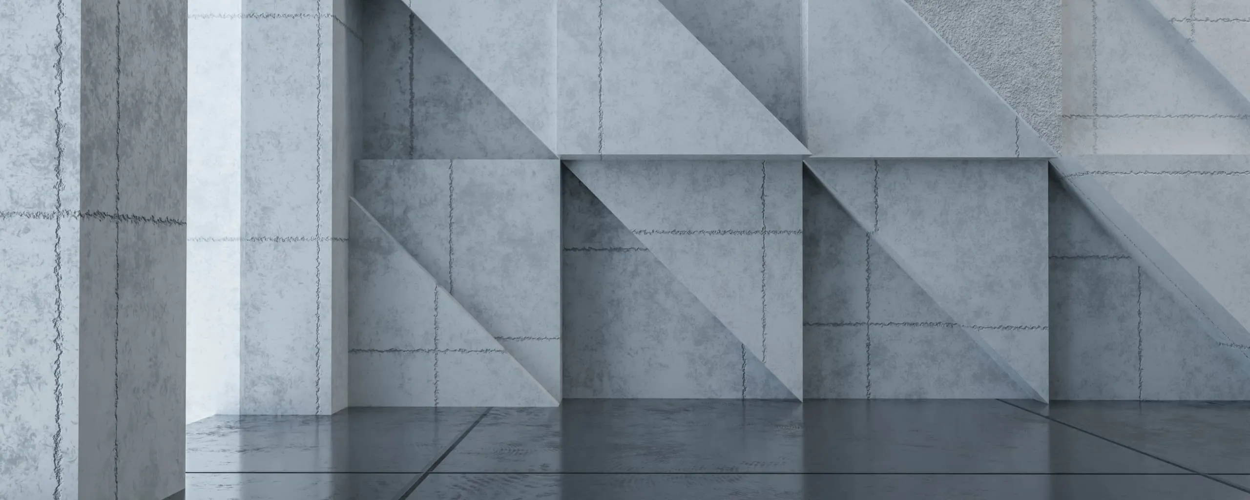 Concrete wall with geometric, angular recesses and visible seams, reflecting onto a smooth, dark floor in a minimalist architectural setting.