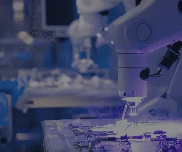 A robotic arm equipped with surgical tools operates over a table of medical instruments in a high-tech, sterile environment.