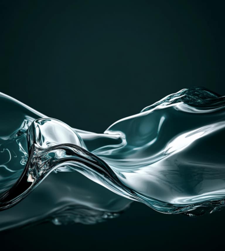 A close-up image of a fluid, glass-like transparent wave against a dark teal background, with smooth, reflective surfaces and abstract flowing shapes.