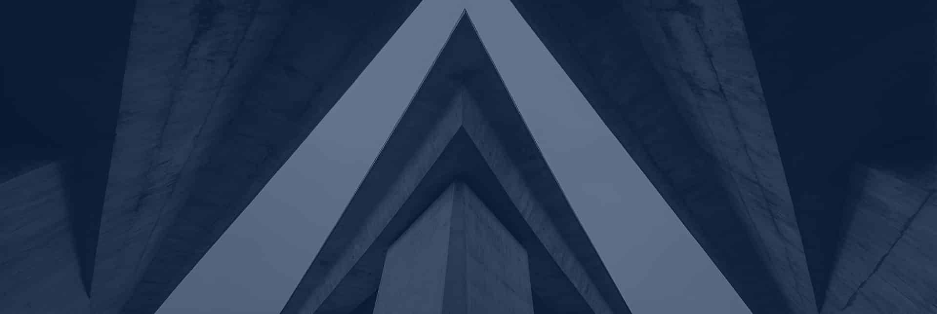 Concrete beams form intersecting triangular shapes viewed from below, creating a symmetrical geometric pattern against the sky, with a blue overlay effect.